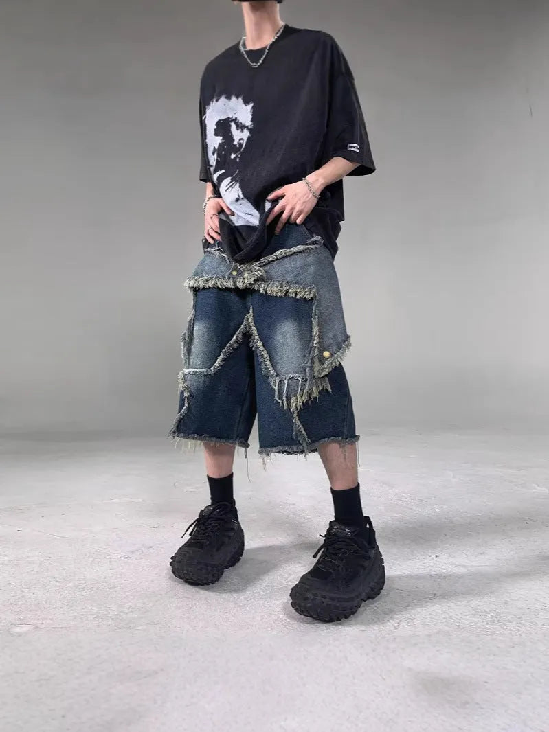 Blue denim shorts with frayed five-pointed star design in loose retro style