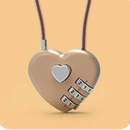 Peach heart shaped combination lock with a black steel rope cable coiled on a table.