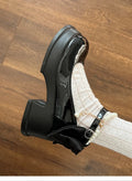 Beige and black women's Mary Jane pumps with a round toe and chunky heel.